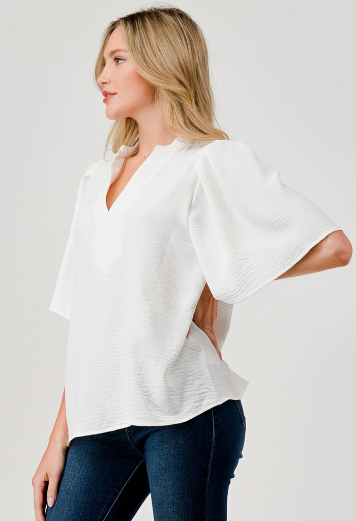 White flutter sleeve blouse