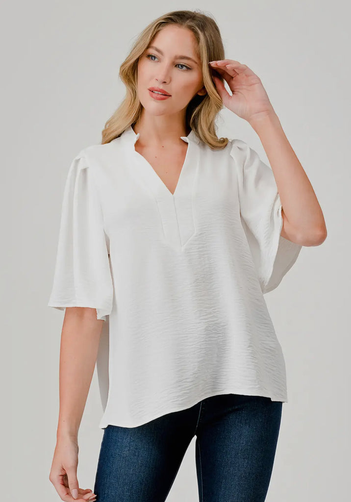 White flutter sleeve blouse