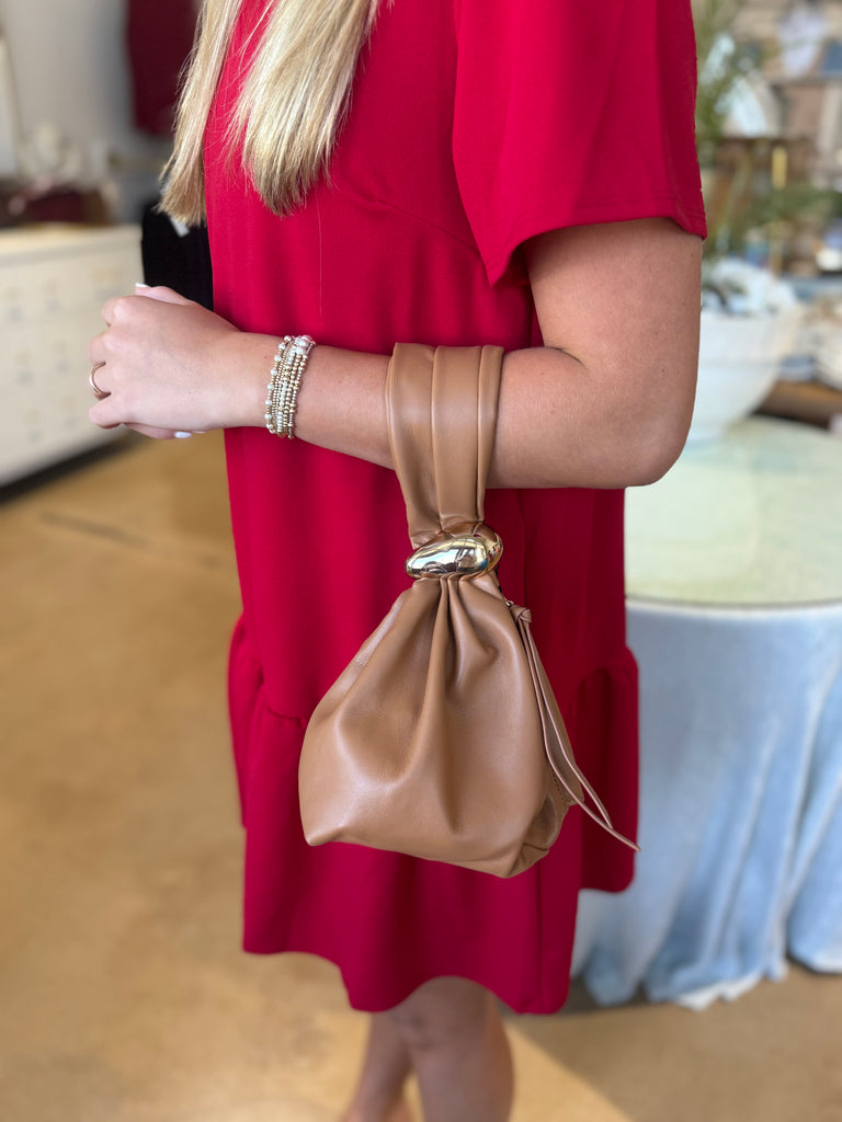 Camel handle drop bag